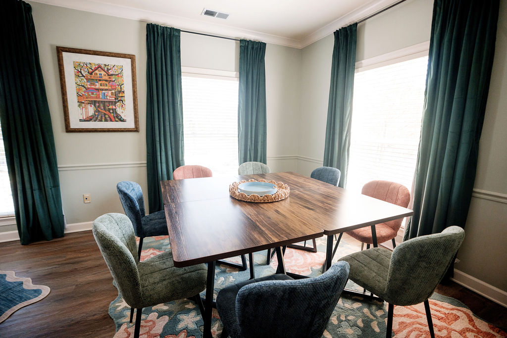 Group therapy room with a large table and chairs at The Storyhouse Counseling Center