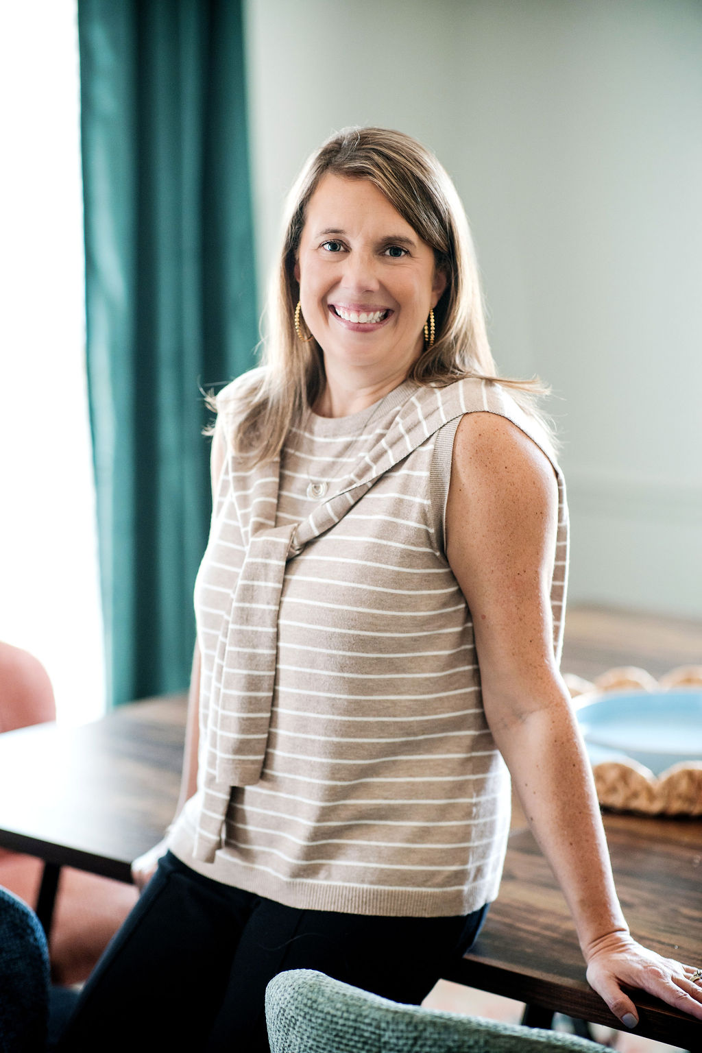 Julie Johnson seated beside a table in the counseling office