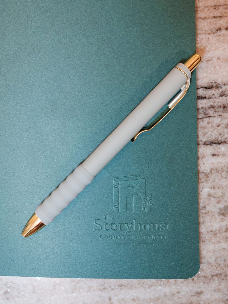 Storyhouse Counseling Center journal and pen